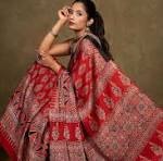Red cloth with a woven geometric border