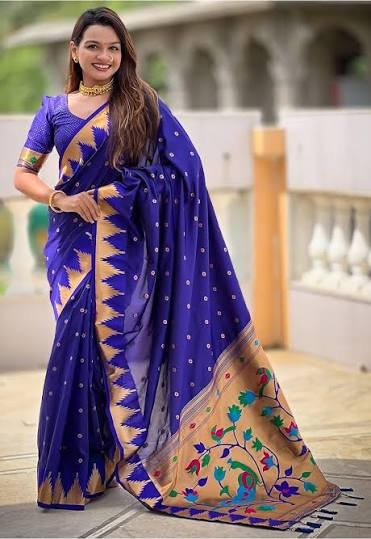 Royal blue Paithani with a gold temple border and a woven peacock pallu, photographed at 5000K